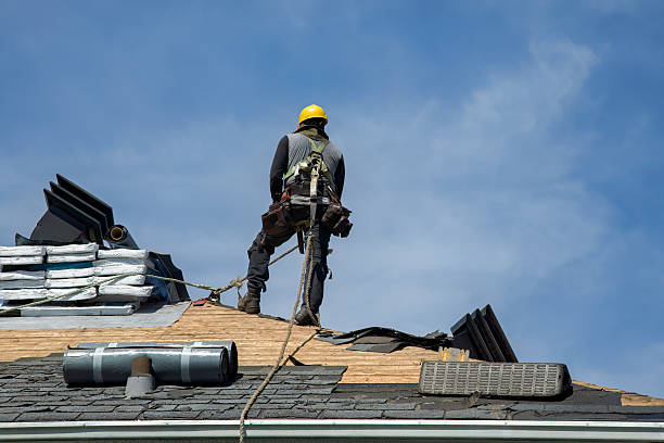 Professional Roofing technician working in Cadogan, PA